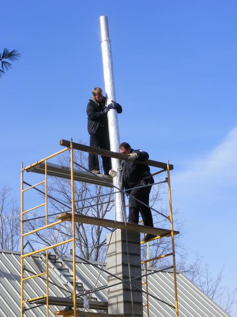 Installing a new insulated liner into a masonry chimney. Leavenworth, Indiana.  