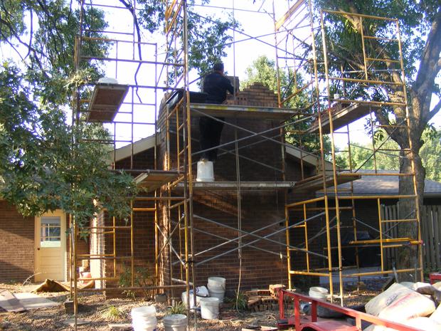 Building Brick chimney  with new Concrete crown Jasper Indiana.