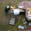 Mixing concrete for a new chimney crown. Paoli, Indiana.