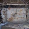 A picture of a  deteriorated masonry fireplace we have gutted before we rebuild it. Bedford, Indiana.