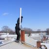 Installing insulated liner into chimney. Jasper, Indiana. 