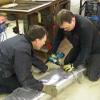 Banding the stainless steel mesh sock at both ends. Dubois, Indiana. 