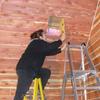 Installing a Class A chimney in a cedar cabin. Cutting hole in ceiling. Hillham, Indiana.   